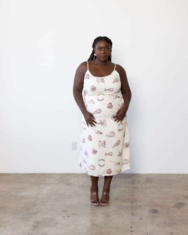 Front of a model wearing a size 0 Yasameen Slip Dress in Cherub Print by Dani Marie. | dia_product_style_image_id:312346